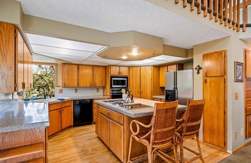 Liberty Lake House | Unique lakefront hideaway with four decks, dock, private hot tub & wood stove