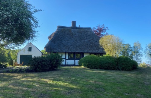 Damp House | Uniquely charming thatched cottage with 900 square meters of land and a view of the Baltic Sea Pure nature