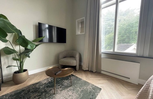 Centrum Apartment | Unwind in this refined suite, blending modern comfort with historic charm.