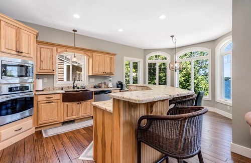 Lochmere House | Unwind in Waterfront Luxury: Custom Home in a Peaceful Cove