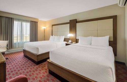 Calgary Hotel | Unwind with Ease: 2 Convenient Rooms, Indoor Swimming Pool, and Free Shuttle