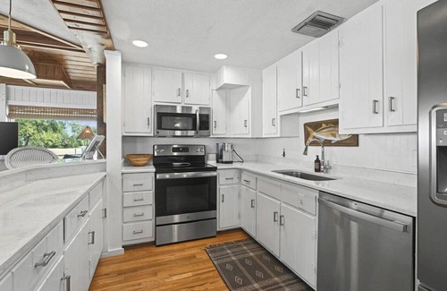 Alligator Point House | Updated Alligator Point bay front home with dock. Great water and sunset views!