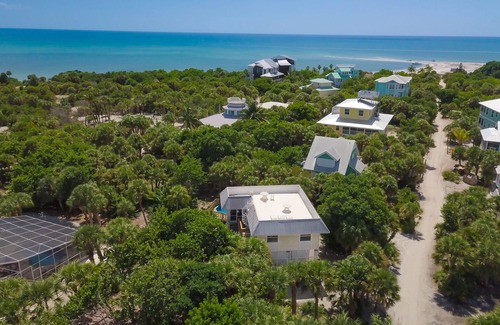 North Captiva House | Upgraded beach house located just steps away from the beach. Pool and Hot tub.