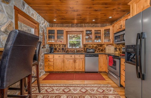 Elk Park Cabin | Upscale mountain log cabin with decks, fireplaces, & two primary bedrooms