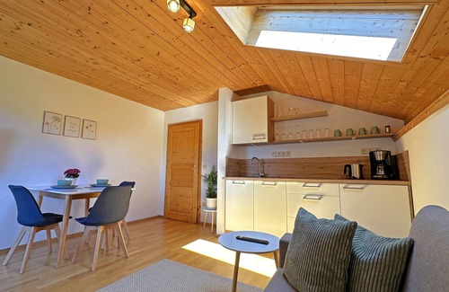 Aschau im Chiemgau Apartment | Vacation apartment Göttersberg 38 sqm, separate bedroom, living room with open kitchen and west-facing balcony