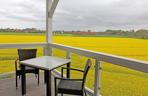 Wremen Apartment | Vacation apartment near the beach with sauna, balcony with beach chair and wonderful view