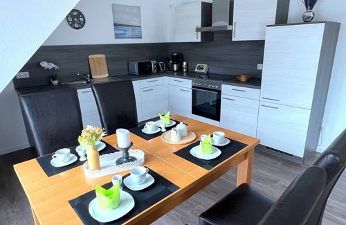 Papenburg Apartment | Vacation apartment "Aurora" Papenburg Large balcony EBK New building 74 sqm Free Wifi 2 bedrooms