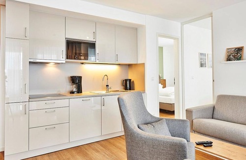 Bensersiel Apartment | Vacation apartment close to the beach with large balcony incl. use of swimming pool & sauna -