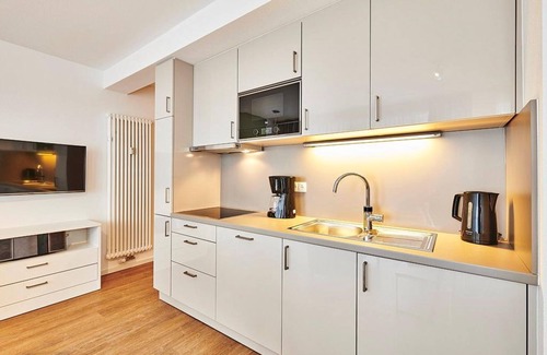 Bensersiel Apartment | Vacation apartment close to the beach with large balcony incl. use of swimming pool & sauna -
