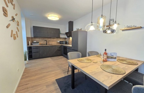 Norden Apartment | Vacation apartment Meeresrauschen on the first floor with garden, sauna and pet