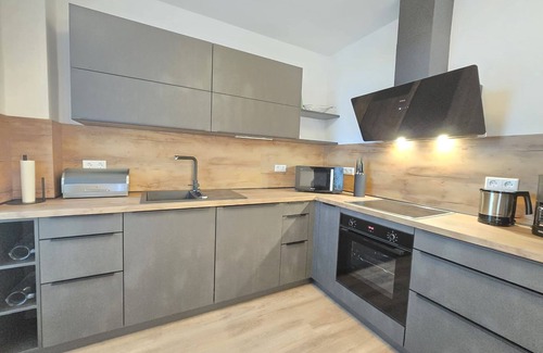 Norden Apartment | Vacation apartment Meeresrauschen on the first floor with garden, sauna and pet