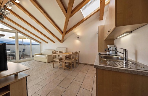 Caldaro Sulla Strada del Vino Apartment | Vacation Apartment "Stompferhof Mansarde" in Caldaro with Shared Pool & Garden