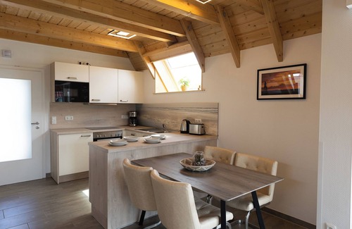 Dorumer Neufeld House | Vacation home Wattwurm. Inviting and with a sun terrace.
