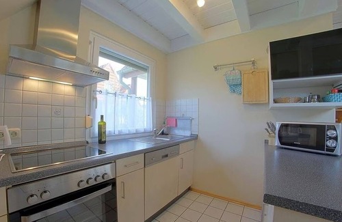 Dorumer Neufeld House | Vacation home "Buß" on the North Sea coast, vacation directly behind the dike!