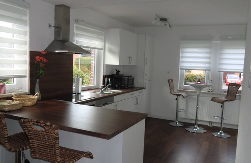 Nordseebad Burhave House | Vacation home Zum Leuchtturm in the middle of Burhave, large living area and garden
