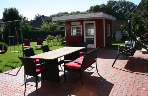 Nordseebad Burhave House | Vacation home Zum Leuchtturm in the middle of Burhave, large living area and garden