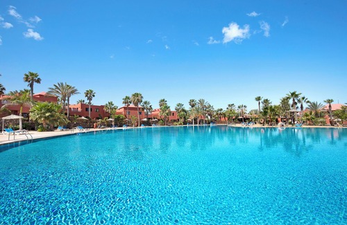 Corralejo House | Vacation Home "Oasis Tamarindo Sport E Relax" with Shared Pool, Private Terraces & Wi-Fi