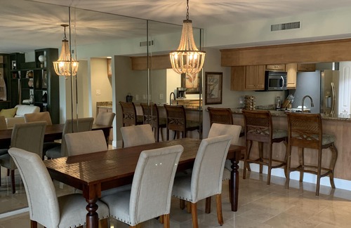 Biggar Condo | Vacation in the Forest CC heated pool view of golf course near beaches airport