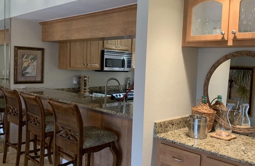 Biggar Condo | Vacation in the Forest CC heated pool view of golf course near beaches airport