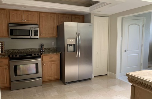 Biggar Condo | Vacation in the Forest CC heated pool view of golf course near beaches airport