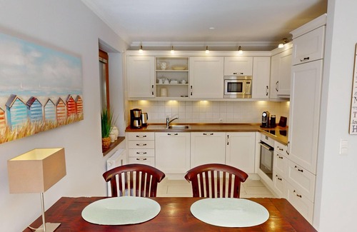 Pelzerhaken Apartment | Vacation oasis close to the beach with sun terrace on the Baltic Sea, for up to 4 people.