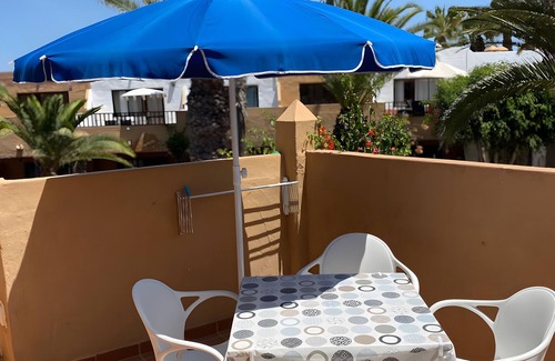 Corralejo Apartment | Vacation 'Oasis Duna Casa Martineli' with Shared Pool, Balcony and Wi-Fi