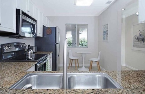 North Naples Condo | Vacation Paradise at "Sunset Tides " Emerald Lakes in North Naples!