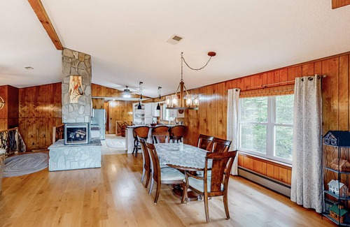 Franklin House | View-worthy home lined by trees with a fireplace, wrap-around deck, grill, & W/D