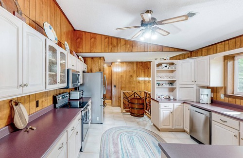 Franklin House | View-worthy home lined by trees with a fireplace, wrap-around deck, grill, & W/D