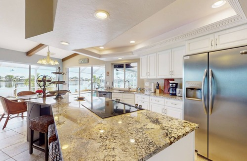 Eight Lakes House | Villa Aasta | Luxe Lakefront Outdoor Living | Screened Pool, Game Room & Dock