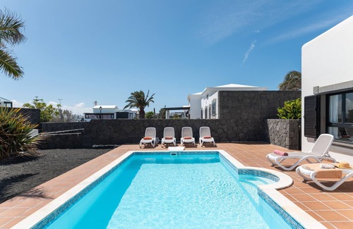 Playa Blanca Villa | 'Villa Ambar' with Mountain View, Sea View, Pool, Wi-Fi, Terraces & Garden