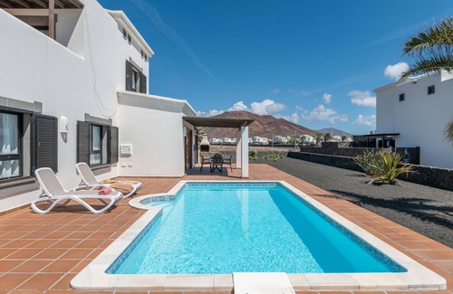 Playa Blanca Villa | 'Villa Ambar' with Mountain View, Sea View, Pool, Wi-Fi, Terraces & Garden