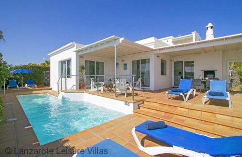 Puerto del Carmen Villa | Villa Benedicte sea view, heated pool, bedroom A/C, WiFi, SKY, short walk to Puerto del Carmen