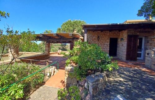 Trinita d'Agultu e Vignola House | Villa La Lecceta surrounded by greenery and sea view with sunset