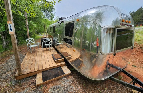Mill Spring House | Vintage 1971 Airstream on the creek, easy access to pool and playground, sleeps 2.