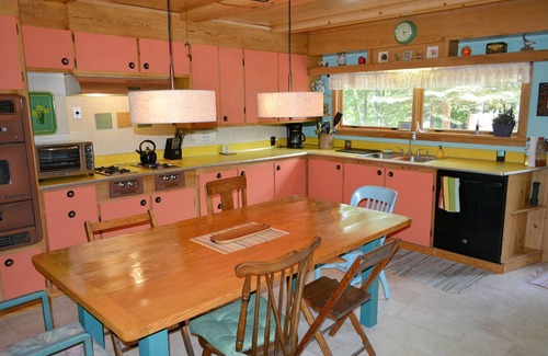Traverse City House | Vintage Artsy Lake Cottage with Island Views