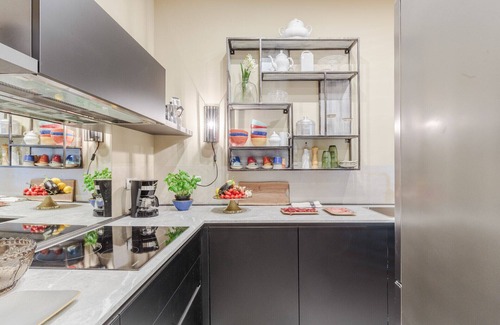 Lucca Historical Center Apartment | Vissi D'Arte, a Luxury Ground Floor Apartment with Private Garden inside the Walls of Lucca