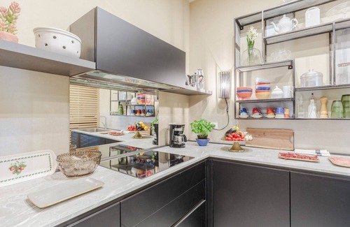 Lucca Historical Center Apartment | Vissi D'Arte, a Luxury Ground Floor Apartment with Private Garden inside the Walls of Lucca