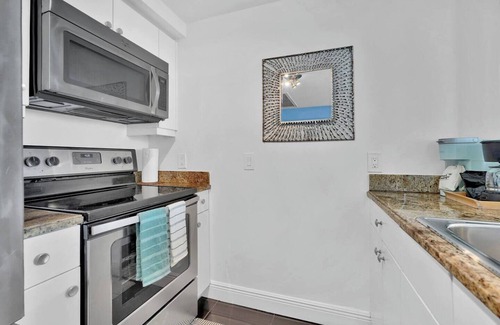 Coconut Grove Apartment | Wake by the Waves. Drift into Calm. Large Balcony