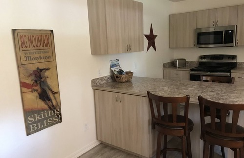 Whitefish Apartment | Walk out into the woods from this studio apartment located close to state lands.