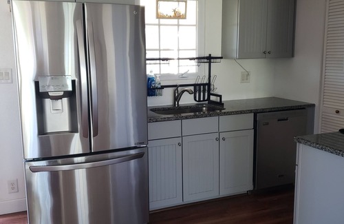 Palm Coast House | Walk to private beach from this cozy, pet friendly cottage in the Hammocks!