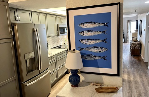 Sunset Reef Condo | Walk to restaurants on Redington Shores beach with wraparound porch.