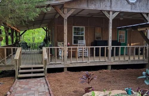 Blountsville Cabin | Watch the birds on a wrap-around porch. Very private and pet friendly.