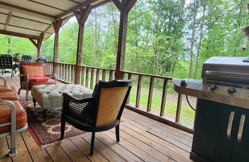 Blountsville Cabin | Watch the birds on a wrap-around porch. Very private and pet friendly.