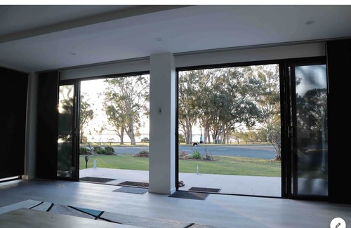 Banksia Beach House | Water front house with magical sunsets