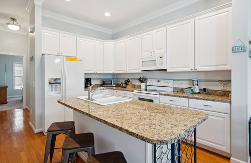 Waters Edge House | Water's Edge 103 - Bright 3BR/3BA Townhome - Pool - Fishing Dock