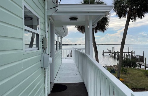 Micco House | Waterfront, 3 bedroom, original 1941 wood, fishing camp, with a deck/dock