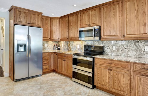 Jupiter House | Waterfront 4bedroom home with boat lift and additional 40' slip at extra cost