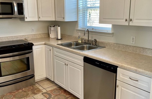 Shoreline Park House | Waterfront Camp in Jourdan River Estates