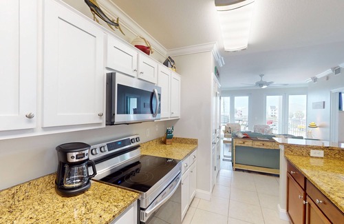 Mexico Beach Condo | Waterfront condo with pool, hot tub, furnished lanai, fireplace & chic furniture